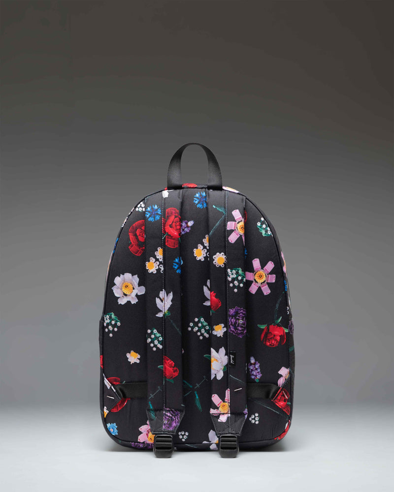 Herschel Supply Co. x LEGO Classic Backpack in the limited-edition Falling Florals print featuring a colorful floral pattern.