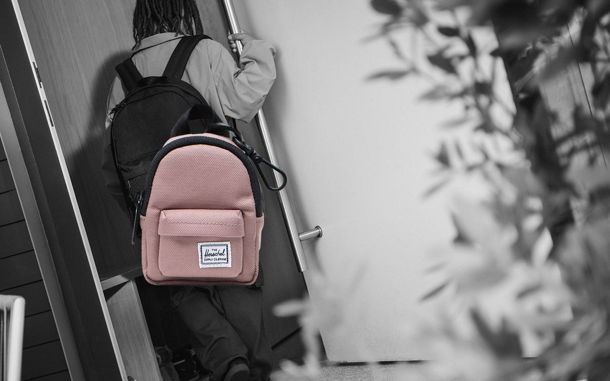 Herschel Supply Co. Classic Backpack Bag Charm in Ash Rose, a miniature pink backpack keychain accessory.
